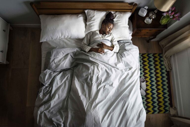 african-american-woman-on-bed-sleeping-PVRR875-scaled